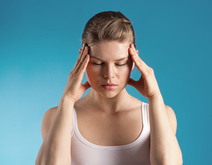 Headache. Young woman tired of insomnia.