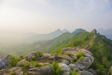 Misty summer mountain hills