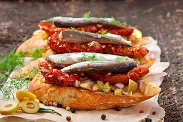 Crostini with anchovies, olives and sun-dried tomatoes