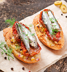 Crostini with anchovies, olives and sun-dried tomatoes