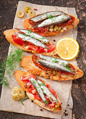 Crostini with anchovies, olives and sun-dried tomatoes