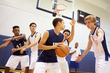 Deurstickers Male High School Basketball Team Playing Game © Monkey Business