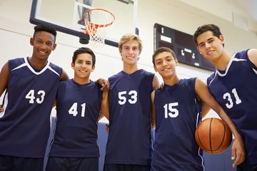 Fotobehang Members Of Male High School Basketball Team © Monkey Business