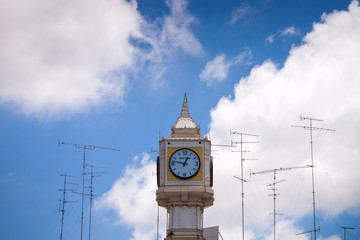 Fototapeta na wymiar Clock tower with TV Antenna