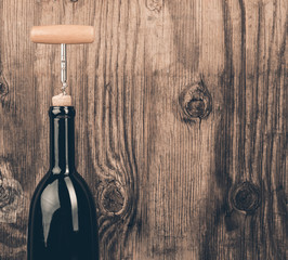 Bottle of wine with corkscrew