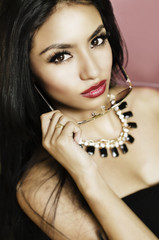 Obraz premium Beautiful exotic young woman long hair