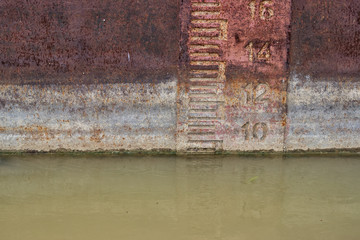 Waterline on old and rusty ship
