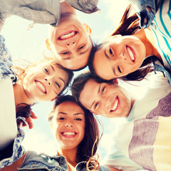 group of teenagers looking down