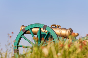 The old fashioned cannon on a hill