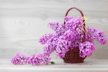 Lilac bouquet isolated on wood background. 