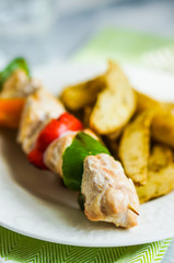 Chicken kebabs with baked potatoes