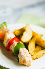 Chicken kebabs with baked potatoes