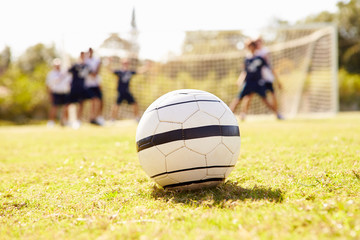 Close Up Of Soccer Ball With Players In Background