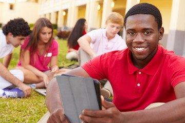 High School Students Studying Outdoors On Campus