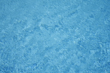 Water background - rippled blue sea water pool surface