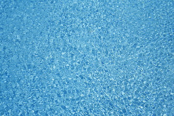 Fototapeta na wymiar Water background - rippled blue sea water pool surface