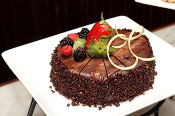 Chocolate cake with fresh fruit decoration.