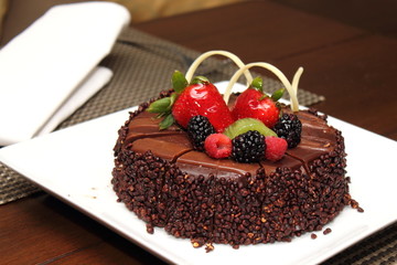 Chocolate cake with fresh fruit decoration.