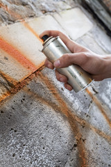 Painting graffiti on the wall