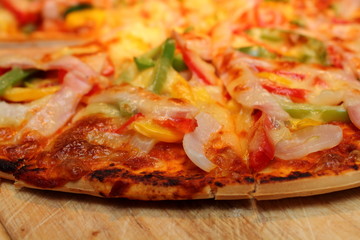 Pizza with diced ham and vegetables