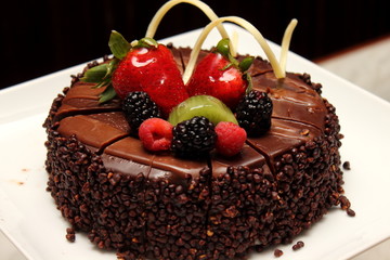 Chocolate cake with fresh fruit decoration.