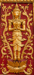 Fototapeta na wymiar Thai angel guardian with foral motif