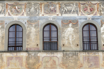 Fototapeta na wymiar Facade of house is decorated with fresco in Florence, Toscany, Italy
