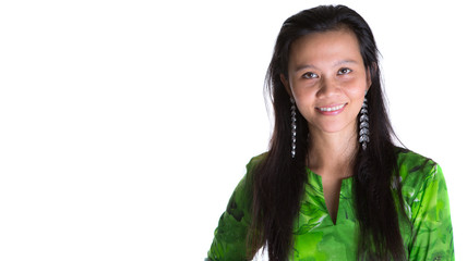 Asian Malay woman in a green national Malaysian dress