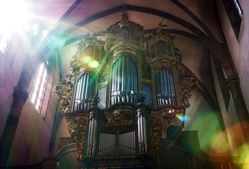Beautiful old organ decorated by gold