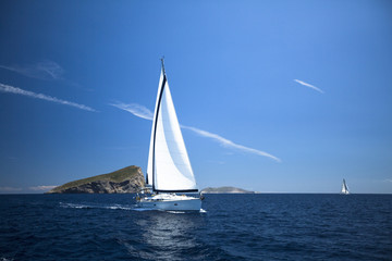 Fototapeta na wymiar Boat in sailing regatta. Luxury yachts.