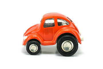 Fototapeta na wymiar Vintage orange tin car