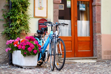 Fototapeta na wymiar Two bikes parked on a street
