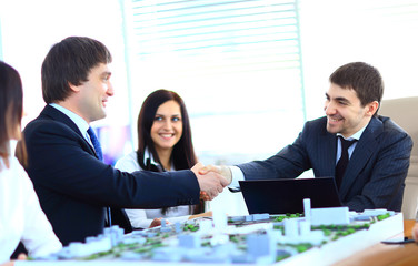 Business people shaking hands, finishing up a meeting