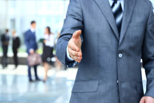 Businessman extending hand to shake