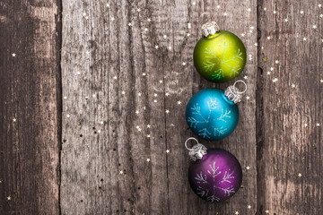 Christmas decoration ball on textured grungy wooden surface