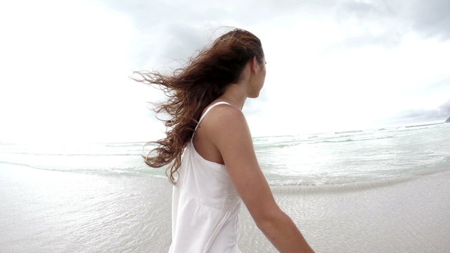 Woman walking at the beach