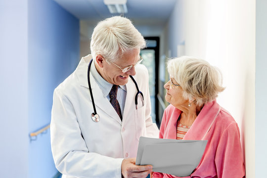 Doctor Talking to Old Woman about Good Results.