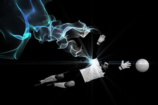 Composite image of goalkeeper in white making a save