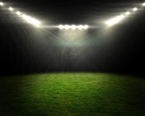 Football pitch under bright spotlights