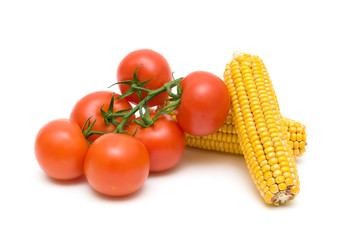 tomatoes and corn closeup on white background