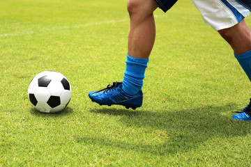soccer player running with ball