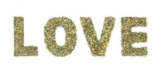 Word LOVE spelled out with  herbs and tea leaves