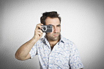 Tourist taking a picture with vintage camera