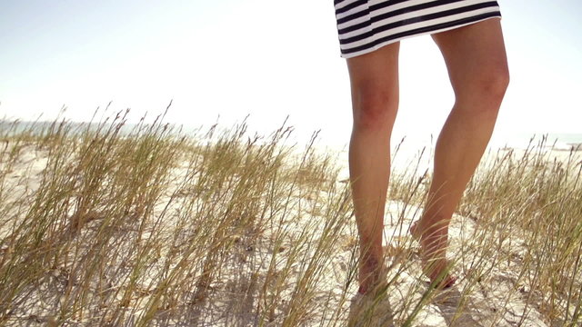 woman on the beach collecting sea shells