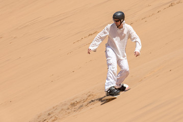 Man enjoying sandboarding