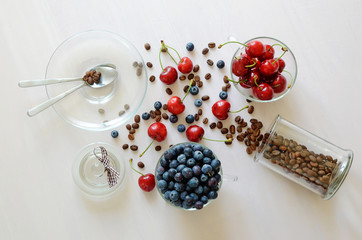 Coffe beans and berries on the table