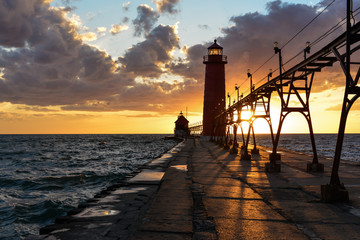grand haven lighthouse in the sunset - obrazy, fototapety, plakaty