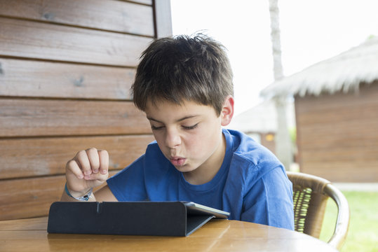 Young boy and a tablet digital