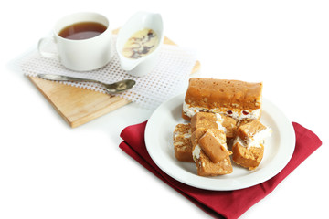 Sherbet with nuts on plate isolated on white