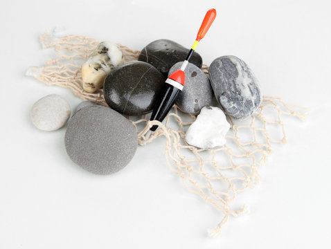 Fishing Float With Stones Isolated On White